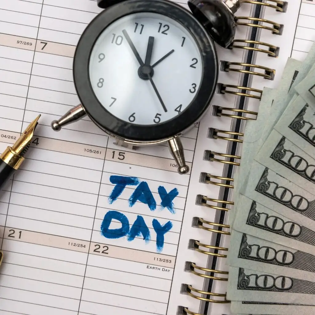 tax day calendar with clock and cash showing IRS back tax debt deadline pressure